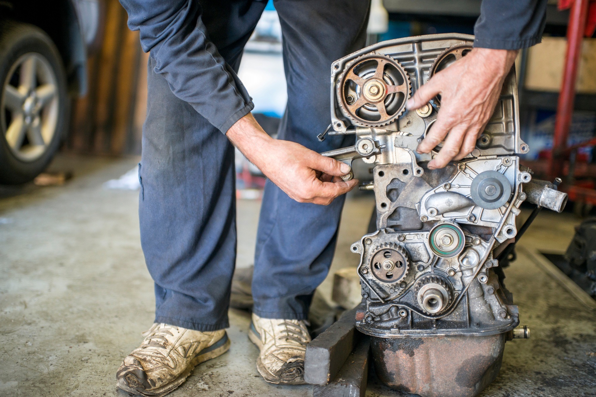Mechanic working on car part Mechanic working on car part
